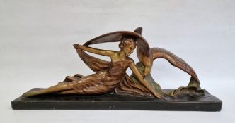 Art Deco large bronzed-effect plaster figure of girl reclining the side with eagle on rock, on black