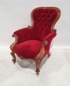 Victorian armchair with red upholstered seat, back and arms, on cabriole front legs to white china