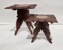 Two Eastern-style coffee tables with carved and shaped top, folding bases (2)