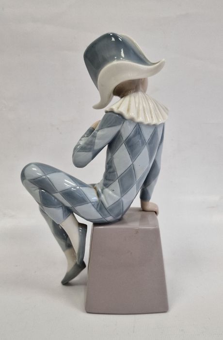 Lladro figure of boy wearing harlequin suit seated on box initialled B, 20.5cm high - Image 3 of 6