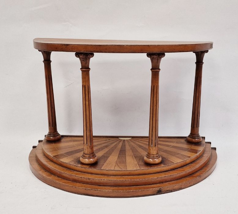 Demi-lune treen stand in the classical taste, the demi-lune top supported by four Corinthian columns