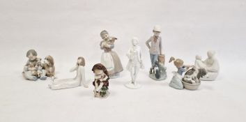 Lladro porcelain group of child seated with dog and puppies, Lladro figure of a girl grooming a dog,