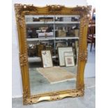 Rectangular mirror with moulded gilt finished frame, 78.5cm high x 109cm wide x 6.5cm deep