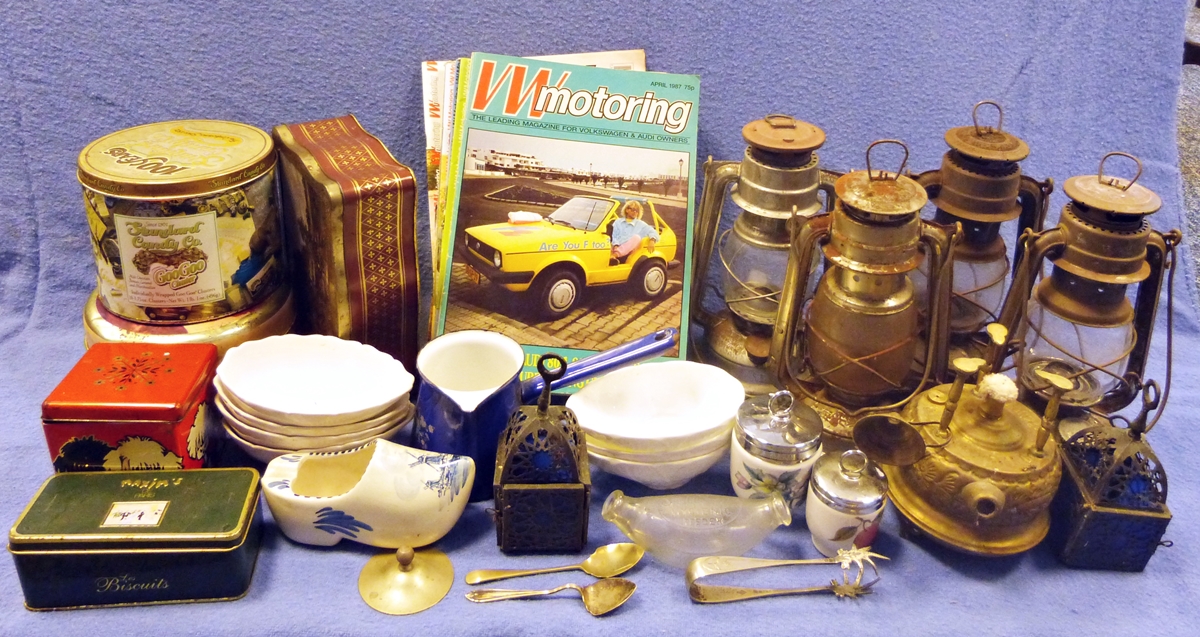 Four metal paraffin lamps, various volumes of VW Motoring magazine, a folding mirror, a print by