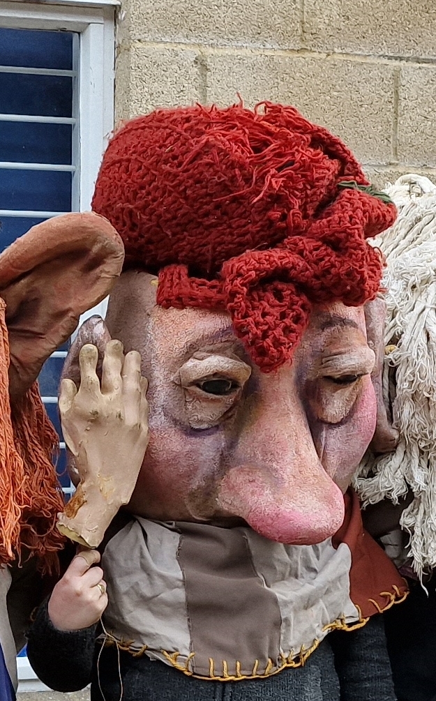 Oversized theatre prop head by Purves Puppets and a pair of moulded rubber hands. Provenance: