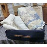 Two vintage quilts, a bedspread and a suitcase