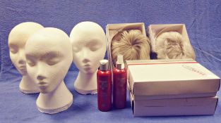 Three polystyrene heads, four wigs and two bags of pillows, duvets, linen, bedspreads,