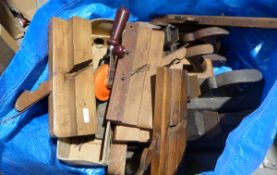 Collection of wooden planes, spirit levels and a hand drill, some named to include L.J. Tanner, W.