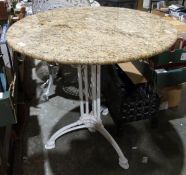 Circular marble-topped garden table with cast iron base