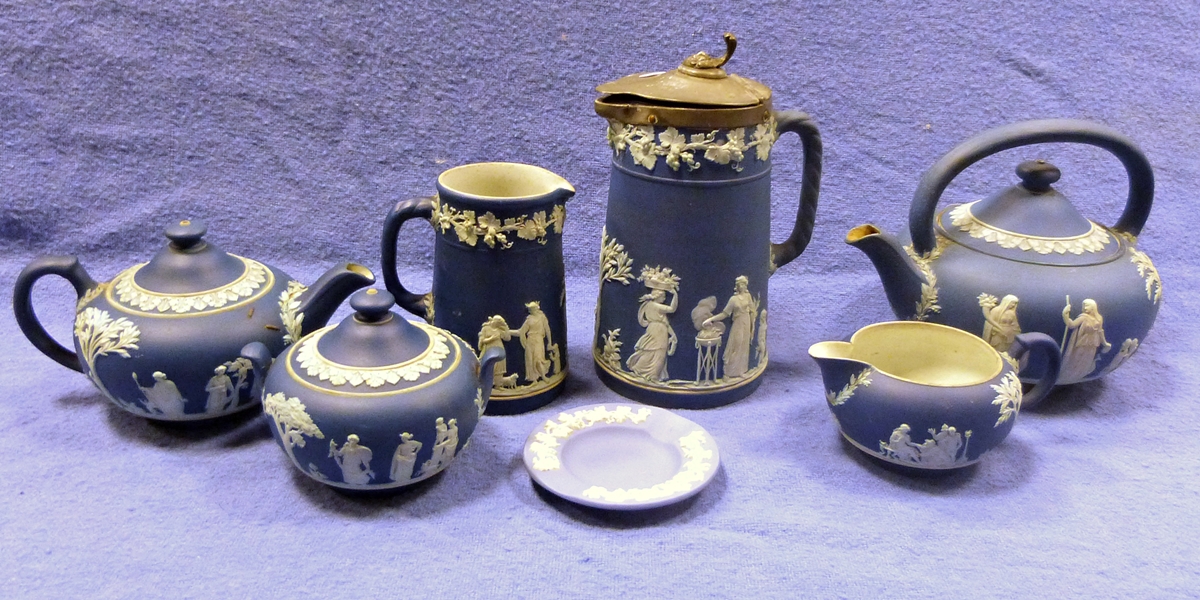 Collection of Wedgwood 'Blue Jasperware' items to include two teapots, creamer, milk jug, sugar