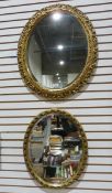 Two gilt framed oval wall mirrors (2)