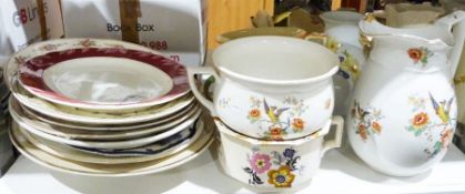 Large quantity of Victorian and later serving platters, a pair of handled vases and chamber pots and