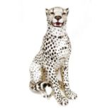 Large ceramic cheetah, 75cm tall approx., a pair of cranberry glass table lamps with matching