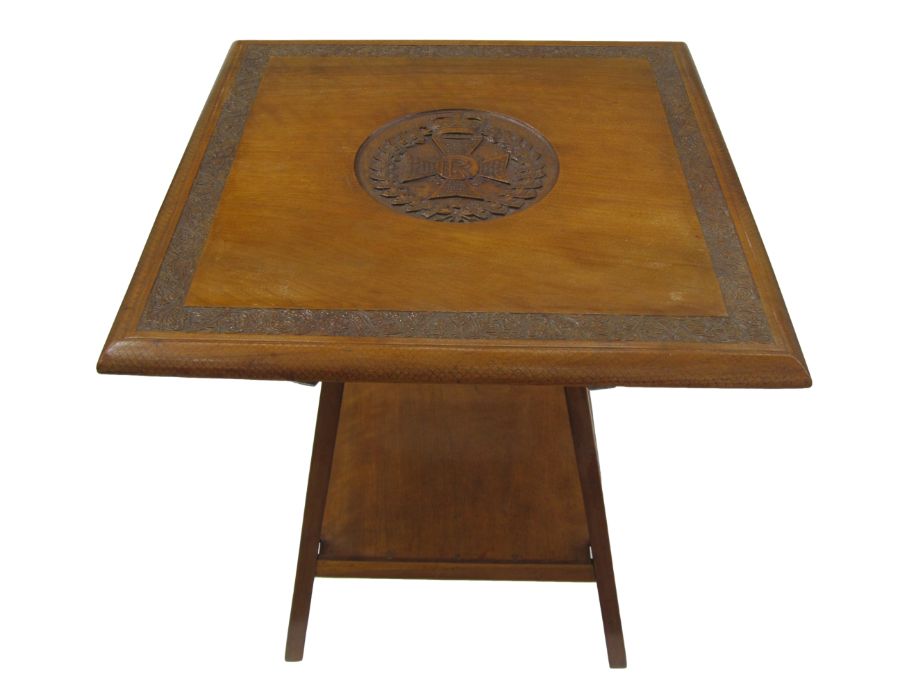 Mahogany table with the badge of the Rajputana Rifles carved into the surface