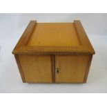 Stained wood table top coin cabinet of 12 drawers enclosed by two doors, approx. 34cm w x 22cm h x