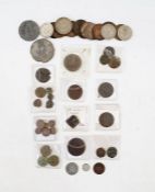 Group of Coins held within a small plastic container, containing a group of lower grade coins from