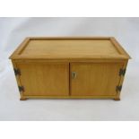 Stained wood table top coin cabinet of 15 drawers enclosed by two doors 52.5cm w x 25.5cm h x 28.5cm