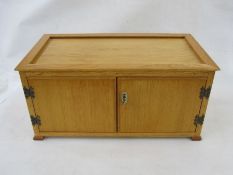 Stained wood table top coin cabinet of 15 drawers enclosed by two doors 52.5cm w x 25.5cm h x 28.5cm