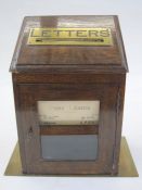 Edwardian brass-mounted manor house letterbox, the sloping front with pierced brass letter aperture,