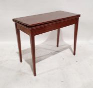 Early 20th century mahogany tea table with rectangular fold-over top, on four square-section