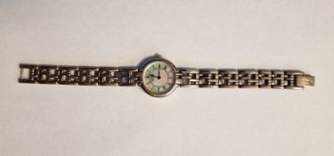 Rotary silver-cased lady's wristwatch, with mother-of-pearl dial, Roman numerals, on a silver link