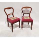 Set of four Victorian mahogany dining chairs with needlework upholstered seats, turned front legs (
