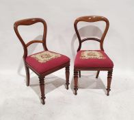 Set of four Victorian mahogany dining chairs with needlework upholstered seats, turned front legs (
