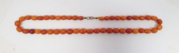 String of amber-coloured graduated oval beads in shades of orange and yellow. weight 30.4 gms approx
