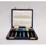 Set of six silver-gilt and harlequin enamel coffee spoons, Birmingham 1970, each with guilloche