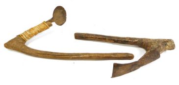 Two African digging tools, wooden handled with iron heads, one head tied the other fitted.