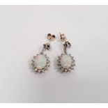 Pair of 18k white gold, diamond and opal drop stud earrings  Condition Report1 opal with cracks.  We
