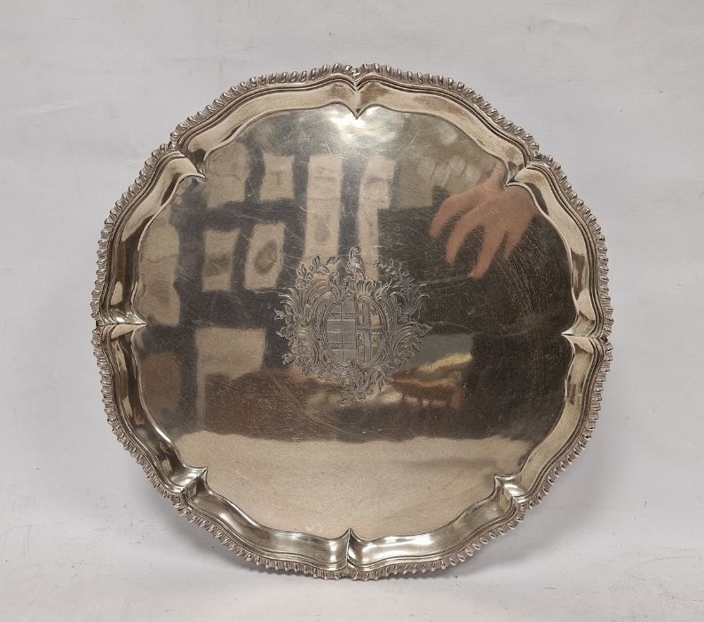 George III silver salver bearing armorial, raised on three feet, London 1768, maker I.C., 33cm