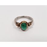 White metal ring set cabochon emerald in gold-coloured ropetwist setting