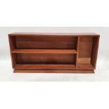 Mid-century modern teak low open bookcase with two shelves and open recess to the right hand side,