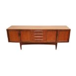 20th century teak G-Plan Fresco sideboard with a nest of four short drawers flanked by cupboards