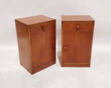 Pair of teak bedside cupboards with single drawer, cupboard door, on plinth base (2)