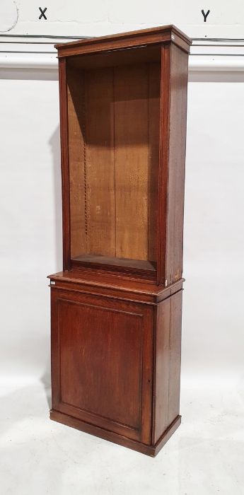 Early 20th century oak bookcase cabinet with adjustable shelves above the single door cupboard