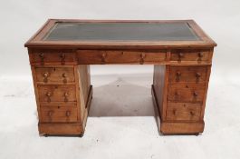 Early 20th century pedestal desk with leather inset top, nine assorted drawers, on plinth base to