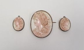 Carved pale pink shell cameo brooch, oval, female bacchanalian profile and pair smaller pendants (3)