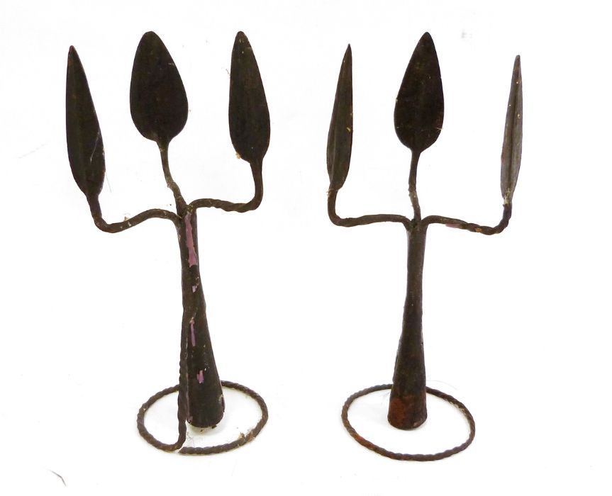 Pair of African metalwares, in the form of a triple-headed spearhead, featuring sections of