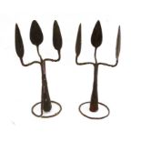 Pair of African metalwares, in the form of a triple-headed spearhead, featuring sections of