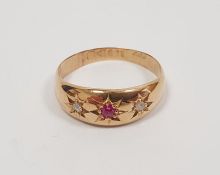Gold, ruby and diamond ring set small ruby flanked by pair tiny diamonds, in rubover setting