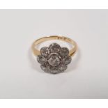 18ct gold and diamond flowerhead cluster ring, circa 1920's, the central stone approximately 0.4ct