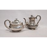 Georgian silver teapot and hot water pot, each with foliate finial handles, bone insulator to the
