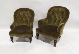 Two Victorian low armchairs in green upholstery, on serpentine front rail, turned front legs to