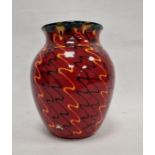 Modern Poole pottery vase with everted rim, ovoid body, the red ground decorated with black and