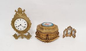 French gilt metal jewellery box, the top with oval ceramic plaque featuring cherub on pagoda top