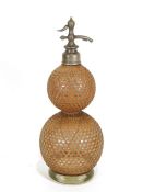 Vintage BA&Co London double-gourd-shaped soda syphon with cane fretwork exterior