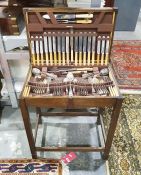 Art Deco style oak canteen table of electroplated cutlery, with knives with plastic handles, by