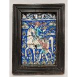 19th century Qajar tile, depicting a horse and rider with falcon, assistant, deer and buildings in